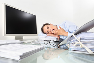 Yawning at desk